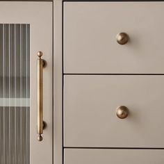 a close up view of a dresser with drawers and knobs on the door handle