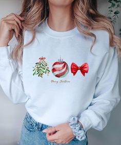 This sweatshirt is perfect for all Christmas lovers. Also as a gift for Christmas.  ♥ PRODUCTION TIME: 1-5 days (Usually 2-3 days) ♥ SHIPPING TIME: 2-5 days (Usually 3 days) ♥ PRODUCT DESCRIPTION: Gildan 18000 Made with a medium-heavy fabric blend of 50% cotton and 50% polyester (8.0 oz/yd² (271.25 g/m this sweatshirt feels cozy and is the perfect choice for those colder months. The classic fit along with the crew neckline deliver a comfy wearing experience with a clean-cut style. Meanwhile, the double-needle stitching at the shoulder, armhole, neck, waistband, and cuff seams add top-tier durability. Say goodbye to itchiness thanks to the gray, pearlized tear-away label. Made using 100% ethically grown US cotton. Gildan is also a proud member of the US Cotton Trust Protocol ensuring ethica Cute White Christmas Sweater, Cute White Christmas Sweatshirt, White Christmas Holiday Sweatshirt, Casual Christmas Sweatshirt For Festive Occasion, Casual Christmas Festive Sweatshirt, White Holiday Sweater As Gift, White Holiday Sweater As A Gift, Holiday Long Sleeve Tops As Gifts, Holiday Long Sleeve Tops As A Gift