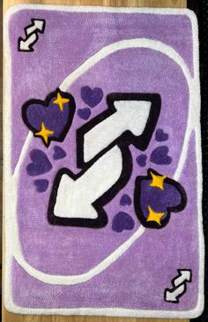 a purple rug with hearts and stars on it