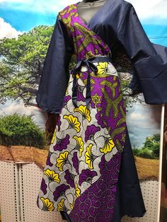 African wrap dress. High quality wrap dress with flowy sleeves for weddings, African events.  Unique one size dress fits up to 2x.  Has Pockets and midi headwrap. Fabric is 100% cotton print. Spring Faux Wrap Midi Dress, Fitted Wrap Dress With Kimono Sleeves For Summer, Fitted Summer Wrap Dress With Kimono Sleeves, Bohemian Flowy Wrap Dress With Surplice Neckline, Bohemian Fitted Wrap Dress With Surplice Neckline, Flowy Wrap Dress With Tie Waist, Flowy Wrap Dress For Spring, Blue Flowy Wrap Dress, Blue Faux Wrap Dress For Spring