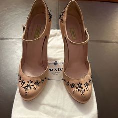 Nude Satin With Black Embroidery And Beading. Some Beads Missing. Includes Two Dust Bags And Replacement Heel Tips. Shoes Prada, Black Embroidery, Prada Shoes, Black Cream, Shoes Women Heels, Beading, Prada, Dust Bag, Shoes Heels