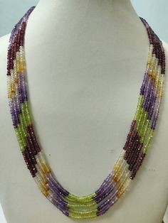 Name Of Stone            : Citrine, Amethyst, Garnet, and Peridot Cut                                : Faceted Color                             : Multi-Color   Shape                            : Roundel Beads Size                    : 3 - 4 mm approx. Number of Strand        : 5 Lines  * Cut & Polished in India * 100% natural & genuine * Measurements & weight are close approximations * We take order work as well. Feel free to contact me for purchasing goods in bulk. * We are manufacturers & Who Luxury Multicolor Faceted Beads Necklaces, Luxury Multicolor Faceted Beads Necklace, Multicolor Amethyst Gemstone Beaded Necklaces, Multicolor Amethyst Beaded Necklaces With Round Beads, Multicolor Beaded Amethyst Necklaces, Multicolor Beaded Amethyst Necklace, Multicolor Rondelle Gemstones For Jewelry Making, Multicolor Gemstone Crystal Necklaces With Round Beads, Multicolor Gemstone Beaded Crystal Necklaces