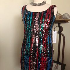 Are You Ready To Party! This Multi-Sequined Sheath Dress In Shades Of Red, Blue, Copper, Green And Black Will Surly Get You In The Mood. If You’re Not Shy, This Dress Is For You. - 32” From Shoulder To Hem - Deep U Neckline In Front - V Neckline In Back - Polyester Lining - 13” Gold Zipper - Sleeveless - Dry Clean Only In The Mood, Calvin Klein Black, Green And Black, Gold Zipper, Shades Of Red, The Mood, Womens Calvin Klein, Sheath Dress, Red Blue