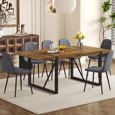 a dining room table with chairs around it