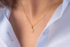 Our snake pendant necklace is made of 14k solid gold. It has a minimalist style that everyone loves it! Our snake's eye consists of zircon stone that looks charming. When you consider our gold snake necklace as a gift, it will make your loved ones happy on their birthday, mother's day, valentine's day, anniversaries, graduations, Christmas, or women's day. 🐍 🎁 If you want, you can add a gift note for your loved ones. It arrives in a special jewelry gift box. ✨ We respond to your questions happily. Your question will be answered within 24 hours. Do not hesitate to contact us. 💎 I hope you have a lot of Onseva's designs. :) (If you want to buy no chain, we suggest that you should pay attention to the closure size of your chain.) a.b.-G Minimalist Snake Chain Charm Necklaces As Gift, Dainty Snake Shape Necklace For Gift, Dainty Snake-shaped Necklace For Gift, Minimalist Yellow Gold Snake Chain Charm Necklace, Minimalist Yellow Gold Snake-shaped Necklace, Gold Snake Necklace, Serpent Necklace, Snake Gift, Small Snake