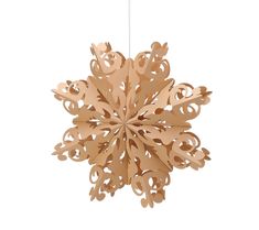 a wooden snowflake hanging from a string on a white background with clippings