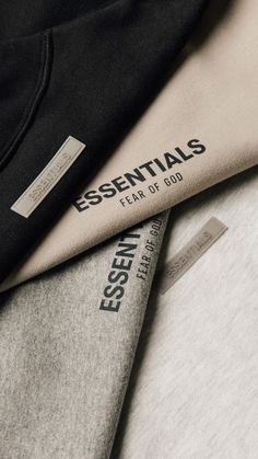 the essentials t - shirt is laid out on top of each other