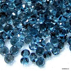 some very pretty blue diamonds on a white surface