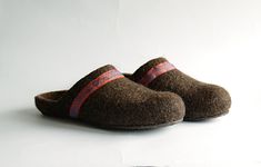 These felted slippers are made using all natural products -wool, hot water and olive oil soap. They are soft and so light that you feel as if you were barefoot. wool breathes so your feet will not sweat in them. Soles are made from natural rubber to prevent them from slipping and make them more durable on any flooring. Choose the colour of the ribbon from the last photo. Wear felted footwear - the feet are warm, and the sheep are intact! - SIZE: this item is made to order. Write me, please, your Brown Wool Slippers With Round Toe, Cozy Brown Slippers With Rubber Sole, Brown Closed Toe Indoor Clogs, Comfortable Brown Wool Slippers, Brown Felt Slippers With Round Toe, Brown Slip-on Felt Slippers, Handmade Brown Closed Toe Slippers, Woman House, Felt Wool Slipper