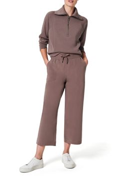 Take on the weekend in sporty-chic wide-leg pants featuring a smoothing high waistband and four-way-stretch fabric that wicks moisture and resists static. 25" inseam; 23" leg opening; 12 1/2" front rise; 17 1/2" back rise (size Medium) Elastic/drawstring waist Front slant pockets Moisture-wicking fabric engineered for dryness and comfort 88% polyester, 12% elastane Dry clean or machine wash, tumble dry Imported