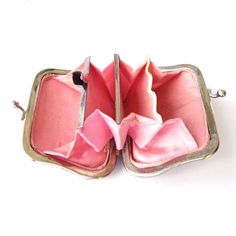 "Item: This is an antique coin purse made in the late 19th century. It has a metal frame and decorative mother of pearl panels on either side. The front is expertly carved with a seaside scene. It opens up to reveal a pink silk lining divided into 4 sections one of which closes up with a hinged clip. This is in excellent condition. Be sure to check our other listings for lots more antique and vintage handbags! Signature: Unsigned Measurements: 2 3/4\" w x 2 1/4\" h Condition: 9.5 - Excellent, li Vintage Compact Evening Wallet, Vintage Compact Wallets For Evening, Vintage Rectangular Coin Purse For Wedding, Vintage Formal Compact Coin Purse, Vintage Compact Coin Purse For Gift, Vintage Rectangular Coin Purse With Coin Pocket, Victorian Rectangular Coin Purse As Gift, Vintage Coin Purse As Gift, Vintage Silver Rectangular Coin Purse