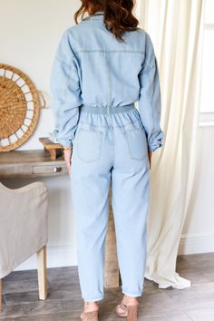 The jumpsuits of all jumpsuits - reprising it's role of our favorite denim jumpsuit - we have restocked this dream denim jumpsuit. Button down denim jumpsuit with button and zipper closure. 100% Cotton Color: Lt. Denim Button Down Jumpsuit Long sleeve Functional pockets Button/Zipper Closure 1/2 elastic waist band (back) Cuffed ankle Collard style Western Belt Detail True to size Model is wearing a size Small. She is 5'6". 130lbs. Bust: 34" Waist 26" Hips 36" Light Wash Button-up Denim Jumpsuit, Fall Light Wash Jumpsuits And Rompers With Pockets, Spring Utility Light Wash Jumpsuits And Rompers, Light Wash Button-up Jumpsuit Or Romper, Light Wash Denim Jumpsuit With Buttons, Relaxed Fit Denim Blue Jumpsuit With Buttons, Utility Denim Jumpsuits And Rompers With Button Closure, Relaxed Fit Denim Jumpsuit With Buttons, Utility Style Button-up Denim Jumpsuit