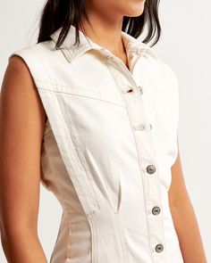 Elevate your wardrobe with the chic and timeless Women's Collared Denim Shirt Dress from Abercrombie & Fitch. This cream-colored dress combines elegance with casual comfort, making it a versatile addition to any fashion-forward collection.

- Size: XL TALL
- Color: Cream
- Material: Cotton, Polyester, Elastane
- Gender: Female
- Age Group: Adult
- Features: Slim fit, fully functional button-through front, flattering seaming details

Crafted in a soft and stretchy denim blend, this dress ensures Fitted Cotton Denim Dress With Buttoned Pockets, Chic Cotton Denim Dress With Buttons, White Fitted Denim Dress With Pockets, Chic Relaxed Fit Denim Dress With Button Closure, Fitted Denim Dress With Buttoned Pockets For Work, Fitted Denim Dress With Button Closure For Work, Fitted Denim Dress With Buttoned Pockets For Day Out, Classic Cotton Denim Dress With Button Closure, Spring Slim Fit Cotton Denim Dress