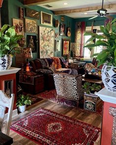 a living room filled with lots of furniture and plants on top of it's walls