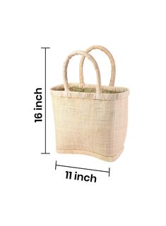 This tote bag with a hard, constructed design is made of raffia exterior, a material of natural origin imbued with a summery mood and lined with woven straw on the inside for added strength and stability. Natural lining on the top and bottom enhances the accessory. Keep your sunglasses, SPF, and essentials beach-ready stylishly stored in this sturdy boho tote. Ideal for Saturdays at the farmer’s market, seaside picnics, running errands, and many more. Gift this raffia tote bag to your fashionabl Natural Rectangular Beach Bag With Leather Handles, Eco-friendly Jute Bucket Bag With Bamboo Handle, Eco-friendly Shoulder Bag With Bamboo Handle, Natural Straw Bags With Fair Trade Details, Natural Straw Bags With Fair Trade, Beige Rectangular Beach Bag With Bamboo Handle, Eco-friendly Beige Beach Bag With Bamboo Handle, Large Eco-friendly Bags With Braided Handles, Large Eco-friendly Bag With Braided Handles