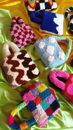 crocheted slippers and mittens laid out on a bed