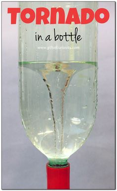 a glass filled with water and the words tornado in a bottle on top of it