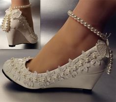 white bridal shoes with pearls and lace