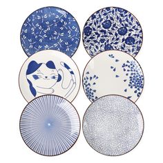 four plates with blue and white designs on them