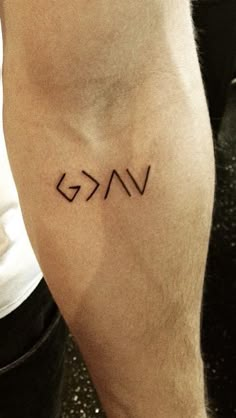 a person with a small tattoo on their leg that says vakg in cursive writing