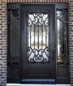 a black door with wrought iron and glass