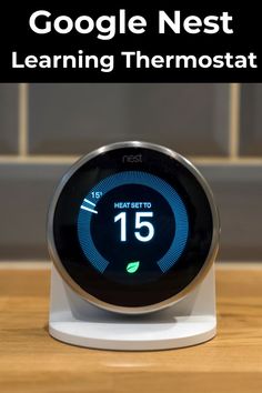 the nest learning thermostat on a table with text overlay that reads google nest learning thermostat