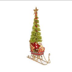 a small christmas tree sitting on top of a sleigh