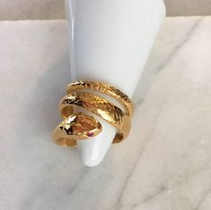 "Unique handmade solid snake ring with realistic scales that give great detail to the outer surface of the ring. Coils comfortably around the finger and is finished with a smoothly polished interior. I designed this ring to be worn either direction and it looks and fits perfectly each way.  The measurement from the space between the tip of the tail to the head on the front of the ring is approx. 5/8\" wide. If you would like to order the ring with the tail to head spacing spread out more, please add this request to the notes area, the furthest the tail to head can be spaced out is up to 1\" wide. Metal: Gold Vermeil Stones in Eyes: Ruby (real faceted round stones) *Unisex - Great His & Her Gift, for Anniversary, Engagement or Birthday.* *READY to SHIP* - Ships in 1 day (For other sizes & c Luxury Spiral Rings As A Gift, Luxury Spiral Ring As A Gift, Luxury Spiral Rings As Gift, Luxury Spiral Ring For Gift, Luxury Spiral Ring As Gift, Elegant Handmade Snake Ring, Light Up Box, Ring With Ruby, Solid Snake