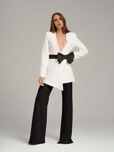 Expect a fusion of classic sophistication and contemporary style in this power suit, constructed from a luxurious stretch crêpe fabric. It is the perfect addition to your statement pieces collection.  The blazer is elevated by padded shoulders and a detachable satin belt fixed in an elegant bow. The trousers boast a high waistband and full-length leg with draped hem detailing creating a flattering elongated silhouette.  Pair the suit with heavily embellished heels and statement jewellery to elev Rare Pearls, Satin Belt, Elegant Blazers, Embellished Heels, Bow Belt, Power Suit, Statement Jewellery, Gifts For New Mums, Belt Black