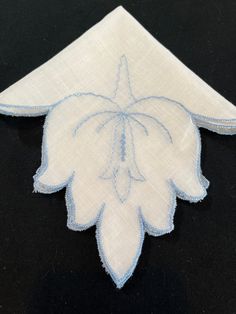 Gorgeous Vintage Embroidered Blue Floral Handkerchief, Hankerchief, Hankie, Vintage Floral Wedding Hanky A beautiful sheer hanky that has a blue flower. The edges are scalloped with a blue trim. This little gem makes a special gift for your favorite bride, Mother of the Bride, soon to be Mother in Law or Grandmother. I've also had brides give them to each of their bridesmaids for those happy tears. Check the pictures and use the zoom feature to see it clearly.  Condition: Excellent vintage condi Elegant Blue Wedding Handkerchiefs, Blue Embroidered Handkerchiefs For Wedding, Blue Embroidered Handkerchief For Wedding, Blue Embroidered Wedding Handkerchief, Traditional Wedding Handkerchiefs With Embroidered Border, Vintage Blue Handkerchiefs With Floral Embroidery, Blue Vintage Handkerchiefs With Floral Embroidery, Blue Embroidered Handkerchiefs For Gifts, Blue Embroidered Handkerchiefs As Gift