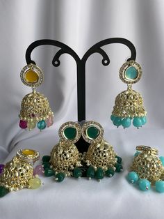 - [ELEGANT DESIGN] The jhumkas are designed to add a touch of traditional elegance to any outfit. - [VERSATILE STYLE] These earrings can be paired with a variety of ethnic wear outfits for a stunning look. - [HIGH QUALITY MATERIAL] Made with high-quality materials to ensure durability and longevity. Festive Multicolor Chandbali Jhumkas, Multicolor Chandbali Jhumkas For Festive Occasions, Multicolor Jhumkas With Latkans For Eid, Green Cutdana Chandbalis For Party, Multicolor Latkans Jhumkas For Wedding, Multicolor Kundan Jhumkas With Latkans, Multicolor Cutdana Jhumkas For Eid, Multicolor Jhumkas For Eid Festival, Multicolor Jhumkas With Latkans For Wedding