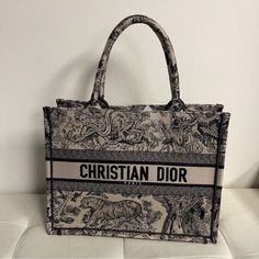 Shop With Confidence! We Only Sell Authentic!!! Brand: Christian Dior Made In Italy Style/Size/Color: Tote Bag/ Approx. 14" W X 10.50" H X 4.5" Dx Handle Drop: 6.5"/Navy Blue Christian Dior Canvas Embroidered Dioriviera Toile De Jouy Book Tote Bag Blue And Ecru Toile De Jouy Reverse Embroidery Introduced By Maria Grazia Chiuri, Creative Director Of Christian Dior, The Dior Book Tote Has Become A Staple Of The Dior Aesthetic. Designed To Hold All The Daily Essentials, The Style Is Fully Embroidered With A Blue And Ecru Toile De Jouy Reverse Motif, A Variation Of The House's Hallmark Pattern With A Play On Reversed Colors. Adorned With The Christian Dior Paris Signatur Designer Embroidered Tote Bag, Designer Embroidered Shopping Bag, Designer Embroidered Bags For Shopping, Designer Embroidered Bags For Daily Use, Reverse Embroidery, Dior Aesthetic, Dior Book, Christian Dior Paris, Dior Paris