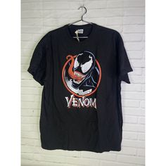 Up For Grabs Is A Brand New Marvel Comics Venom Short Sleeve Logo Graphic Tee T-Shirt Black Red Men's Size Large. Never Worn Or Used. Measurements Laying Flat Are Included In Photos. Please Refer To All Photos. Ask Any Questions Prior To Purchasing. Thanks! Black Pop Culture T-shirt For Comic-con, Black T-shirt With Graphic Print For Comic-con, Black Graphic T-shirt For Comic-con, Black Graphic Print T-shirt For Comic-con, Black Fandom T-shirt For Halloween, Black Tops With Screen Print For Fan Conventions, Black Screen Print Tops For Fan Conventions, Cotton Top For Comic-con Fan Merchandise, Cotton Tops For Comic-con Fan Merchandise