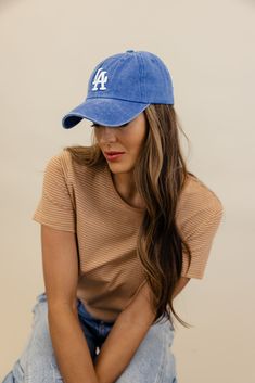 Introducing The LA Baseball Cap! This cute hat adds a touch of West Coast charm to any outfit. Coming in two washed colors, this cap is perfect for those laid-back days under the sun. metal buckle with hidden snap for easy on + off 100% cotton Trendy Cotton Snapback Hat For Beach, Trendy Washed Baseball Cap, Trendy Washed Snapback Hat, Summer Everyday Snapback Baseball Cap, Everyday Summer Snapback Baseball Cap, Casual Snapback Hat With Curved Visor For Summer, Trendy Washed Baseball Cap With Curved Bill, Casual Distressed Baseball Cap For Summer, Casual Curved Visor Snapback Hat For Summer