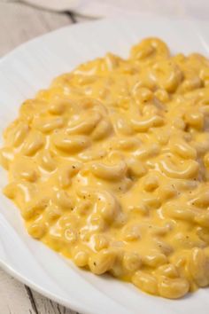 a white plate topped with macaroni and cheese