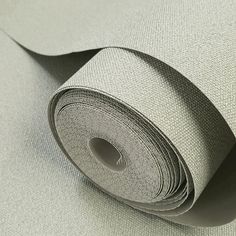 a roll of gray fabric on top of a table