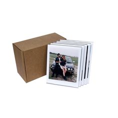 a set of six polaroid photos sitting in front of a cardboard box