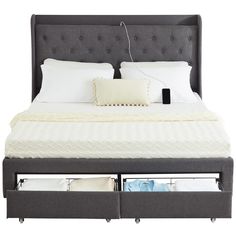 a bed with two drawers underneath it