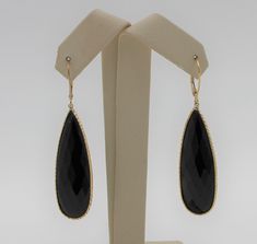 "Beautiful dangle earrings.  Vintage gold handmade earrings with a black onyx stone as a drop. Authentic 14K yellow gold black onyx drop earrings, excellent condition. Earring length: 2.21\" (56.03mm) Earring width: 0.55\" (13.92mm) Earrings weigh: 9.3g Will be placed into a suitable gift box. Free shipping within the U.S." Luxury Onyx Drop Earrings, Black Teardrop Fine Jewelry Earrings, Formal Onyx Gemstone Earrings, Luxury Black Drop Jewelry, Luxury Yellow Gold Onyx Earrings, Elegant Onyx Drop Jewelry, Elegant Yellow Gold Onyx Earrings, Elegant Black Long Drop Jewelry, Fine Jewelry 14k Gold Black Earrings