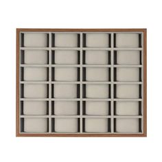 an empty wooden box with many compartments on the bottom and sides, all lined up in rows