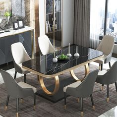 a dining room table with white chairs and a black marble top