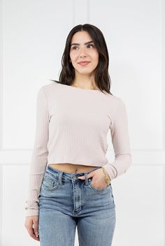 The Phoebe Long Sleeve Crop Top from By Together is the perfect essential top to add texture to any outfit! This soft and stretchy top features a rounded neckline, ribbed fabric and long fitted sleeves. Its lightweight feel makes it perfect for layering under an oversized tee or for wearing on it's own with your favorite pair of straight leg denim! Fabric: 63% Polyester, 33% Rayon, 4% Spandex Measurements: Bust(Size M): 15'' Length (Size M): 16.5'' True To Size Fit S 0-6 M 6-10 L 10-14 Ladies Of Spring Cropped Tops With Ribbed Neckline, Chic Ribbed Top For Spring, Chic Ribbed Spring Top, Solid Cropped Knit Top For Spring, Spring Ribbed Stretch Tops, Chic Ribbed Long Sleeve Top With Stretch, Chic Ribbed Crop Top For Spring, Spring Stretch Ribbed Knit Top, Spring Knit Top With Ribbed Neckline