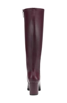 Channel your inner secret agent in these sleek and sexy knee high faux leather boots with a modest heel and high fashion square toe. . Square toe. Knee length shaft. Block heel. Zip closure. Central seam detail. Approx. 16" shaft height, 15" opening circumference. Approx. 2.75" heel . Imported Faux leather construction Classic Fitted Platform Boots With Square Toe, Office Knee-high Boots With Sculpted Heel And Square Toe, Fitted High Shaft Knee-high Boots For Office, Tall Fitted Platform Boots For Work, Fitted Knee-high Boots For Office, Knee-high Faux Leather Heeled Boots For Office, Knee-high Boots For Office With Medium Width, Office Knee-high Boots With Stacked Heel, Modern Fitted Knee-high Boots For Business