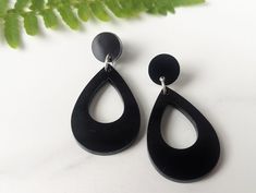 "These earrings are made from shiny black resin. They hang from handmade sterling silver ear wires and measure just over 1.5\" long and 1\" wide." Cheap Black Resin Earrings, Modern Black Hypoallergenic Jewelry, Modern Black Long Drop Jewelry, Nickel-free Black Teardrop Jewelry, Nickel Free Black Teardrop Jewelry, Black Teardrop Modern Jewelry, Black Teardrop Jewelry With Matching Earrings, Black Drop Jewelry With Pierced Details, Black Drop-shaped Pierced Jewelry