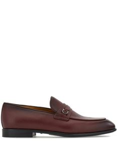 bordeaux red leather grained texture Gancini plaque slip-on style low stacked heel tonal stitching strap detailing almond toe branded leather insole leather sole Luxury Burgundy Leather Shoes For Business, Burgundy Slip-on Formal Loafers, Burgundy Slip-on Loafers For Formal Occasions, Burgundy Slip-on Leather Shoes For Business, Burgundy Slip-on Dress Shoes For Business, Burgundy Leather Loafers For Business, Luxury Burgundy Loafers For Formal Occasions, Burgundy Leather Sole Loafers For Workwear, Formal Textured Leather Loafers With Round Toe