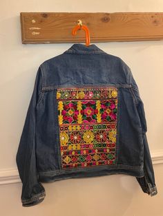 Mini Indie embroidered denim jackets are handmade by Esme in Manchester UK.  Size U.K. 13 years  Stone washed denim jacket with two front pouch pockets and button opening. Embroidered back with beautiful woven Indian braid.  EsmeAndTheEye upcycles second-hand denim jackets and gives them a new lease of life by adding beautiful Indian braid and embroidered textiles.  Each piece is hand picked by Esme and loving re-worked to create a hippie unique jacket. Esme designs each piece unique so you will Indian Braids, Embroidered Textiles, Customised Denim Jacket, Style Festival, Unique Jackets, Embroidered Denim Jacket, Jean Vintage, Festival Style, Embroidered Denim