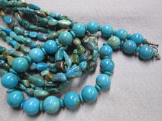 the necklace is made up of turquoise beads