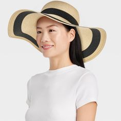 Update your summer accessories with this Striped Straw Floppy Hat from Shade & Shore™. This woven floppy hat features a striped pattern for a chic, contrasting look. Made of midweight paper straw material, it provides a comfortable fit for all-day wear, and the pull-on style makes it easy to put on or take off. Plus, the 4.75-inch brim keeps your face shaded from the sun's rays. Shade & Shore™: Found exclusively at Target. Striped Bucket Sun Hat For Beach, Summer Beach Hat With Stripes, Striped Summer Hats For Vacation, Striped Bucket Hat For Beach, Striped Bucket Hat For The Beach, Summer Striped Vacation Hat, Summer Vacation Striped Hat, Adjustable Striped Straw Sun Hat, Striped Brimmed Sun Hat For Beach