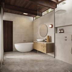 a bathroom with a large tub, sink and shower head in it's center