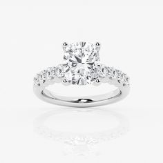 a diamond engagement ring on a white background